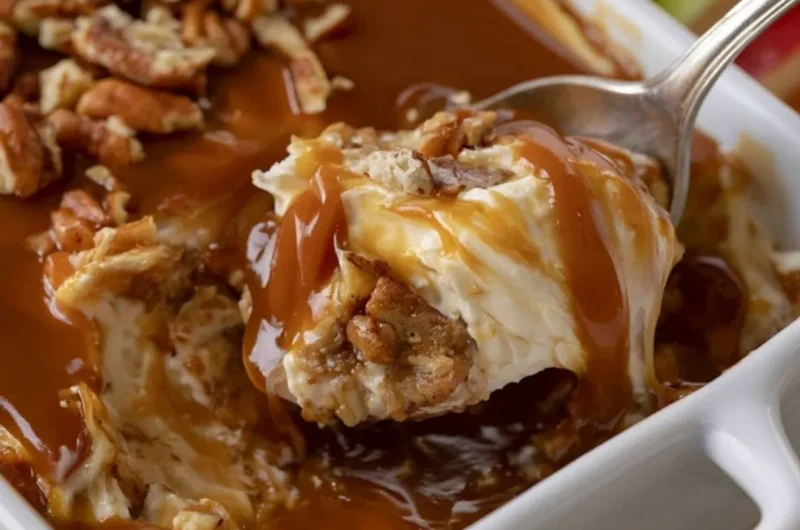 Delicious caramel apple cheesecake dip served in a bowl with apple slices