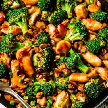 Delicious Chicken Broccoli Stir Fry garnished with sesame seeds and served in a bowl