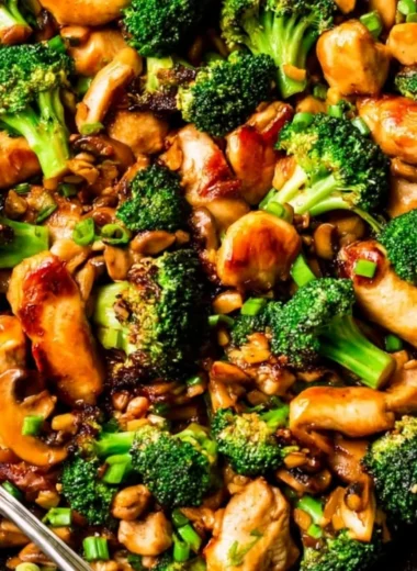 Delicious Chicken Broccoli Stir Fry garnished with sesame seeds and served in a bowl