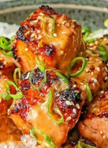Cozy Bang Bang Salmon dish served on a plate with fresh herbs
