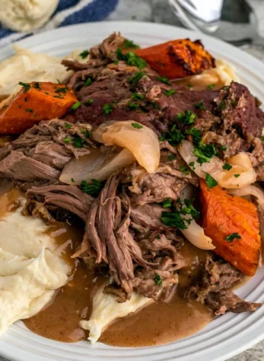 Cozy Crock Pot 3-Packet Pot Roast cooking in a slow cooker