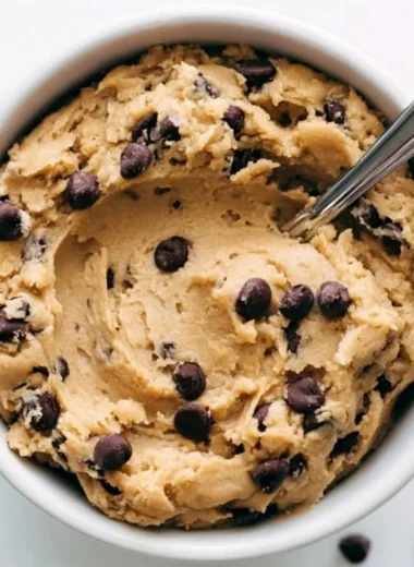 Cozy edible cookie dough in a bowl ready to enjoy.
