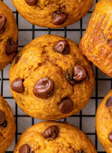 Easy mini pumpkin muffins fresh out of the oven, perfect for fall baking.