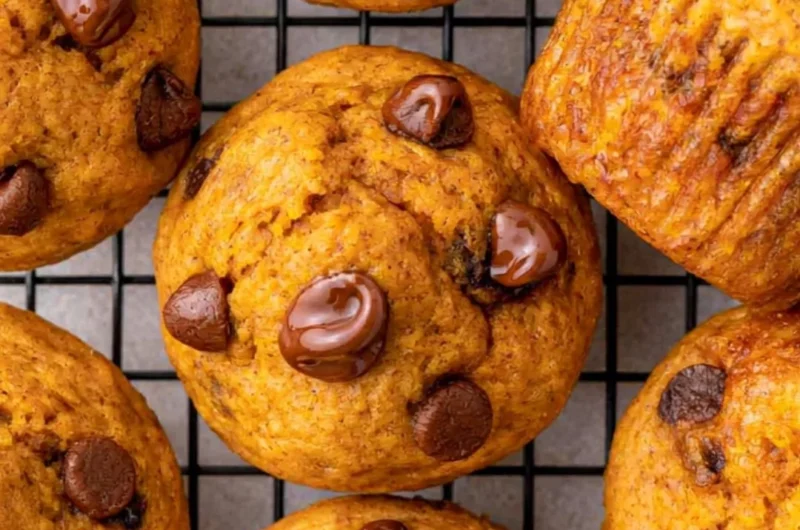Easy mini pumpkin muffins fresh out of the oven, perfect for fall baking.