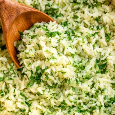 Cozy cilantro lime rice served in a bowl with fresh cilantro and lime slices