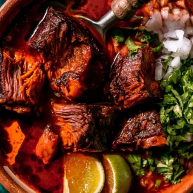 Delicious plate of Authentic Mexican Birria with traditional spices and toppings