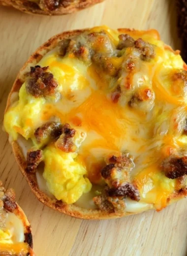 Cozy English muffin breakfast pizza topped with cheese and toppings