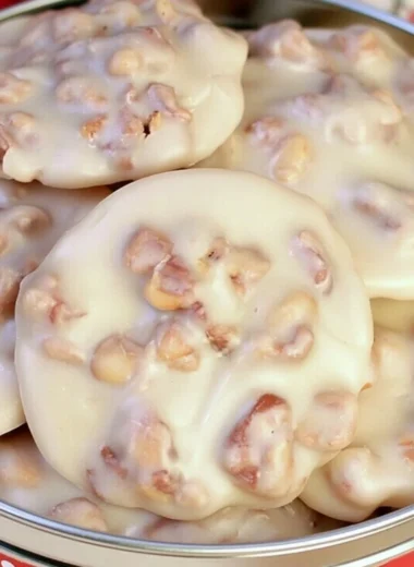 Cozy vanilla pecan pralines with nuts and caramel drizzle on a rustic plate