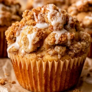 Deliciously baked cozy apple crumble muffins with a crunchy topping