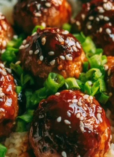 Delicious Cozy Asian Meatballs served with noodles and dipping sauce