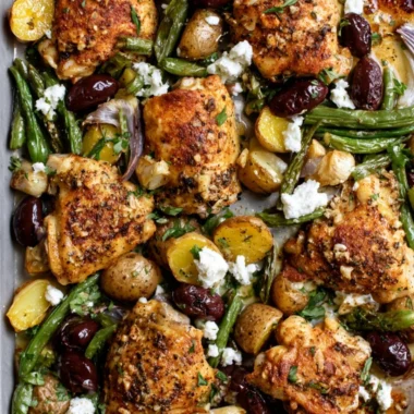 Cozy One-Pan Mediterranean Chicken dish featuring vibrant vegetables and herbs.
