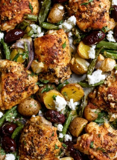 Cozy One-Pan Mediterranean Chicken dish featuring vibrant vegetables and herbs.