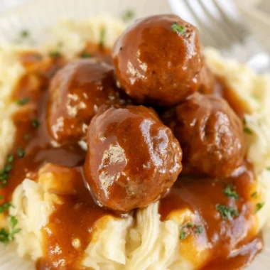 Slow cooker Salisbury steak meatballs served with mashed potatoes and gravy