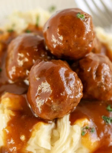 Slow cooker Salisbury steak meatballs served with mashed potatoes and gravy