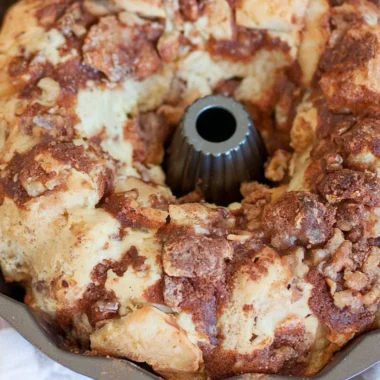 Cozy walnut and apple coffee cake served on a rustic table.
