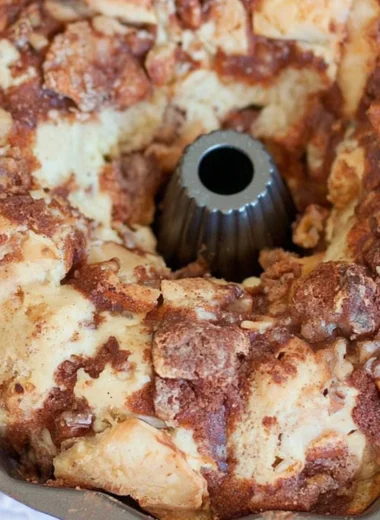Cozy walnut and apple coffee cake served on a rustic table.