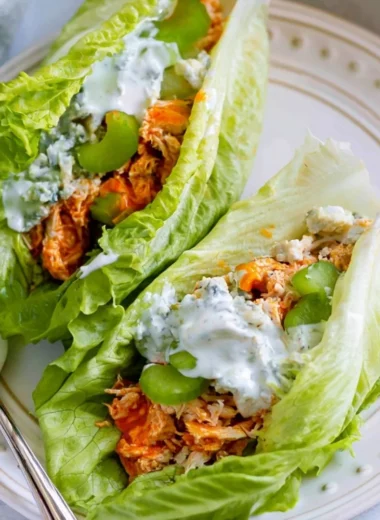 Healthy buffalo chicken lettuce wraps filled with vibrant ingredients.