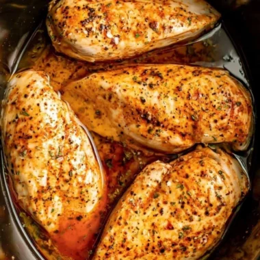 Delicious slow cooker chicken breasts served with vegetables for a comforting meal