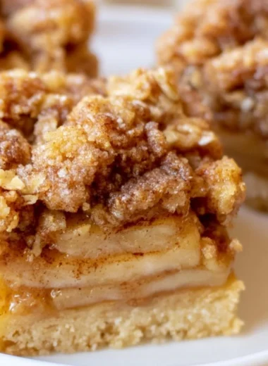 Delicious warm apple pie bars topped with cinnamon and sugar