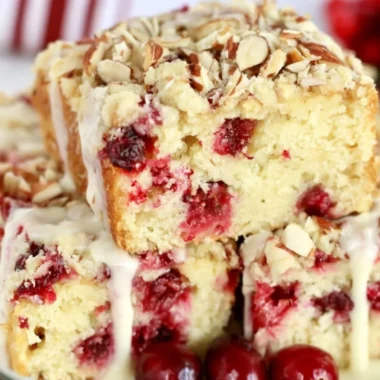 Delicious Cranberry Almond Cake topped with fresh cranberries and almonds