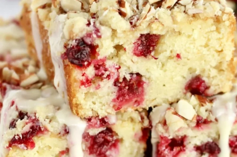Delicious Cranberry Almond Cake topped with fresh cranberries and almonds