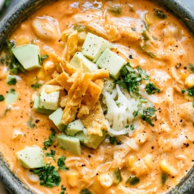 Bowl of award-winning white chicken chili topped with cilantro and jalapeños