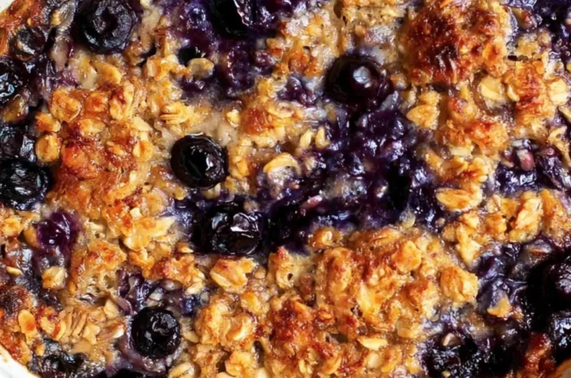 Delicious blueberry baked oatmeal topped with fresh blueberries and almonds.