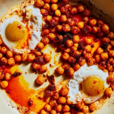 Chickpea fried eggs served on a plate with herbs and spices
