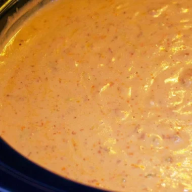 Creamy chorizo cheese dip in a crockpot served with tortilla chips