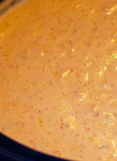 Creamy chorizo cheese dip in a crockpot served with tortilla chips