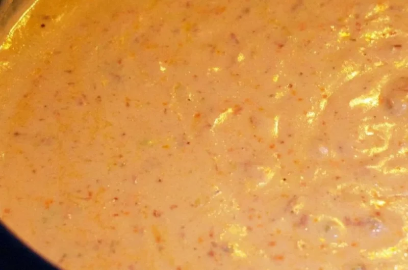 Creamy chorizo cheese dip in a crockpot served with tortilla chips