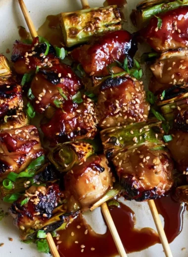 Grilled teriyaki chicken on a stick served with vegetables