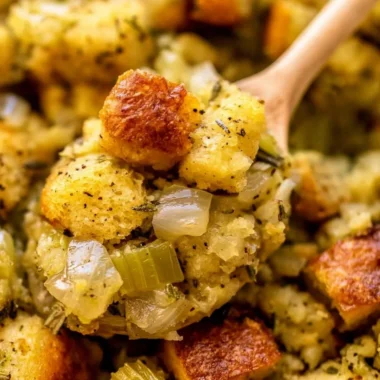 Classic stuffing with buttery bread cubes, onions, and celery on a holiday table